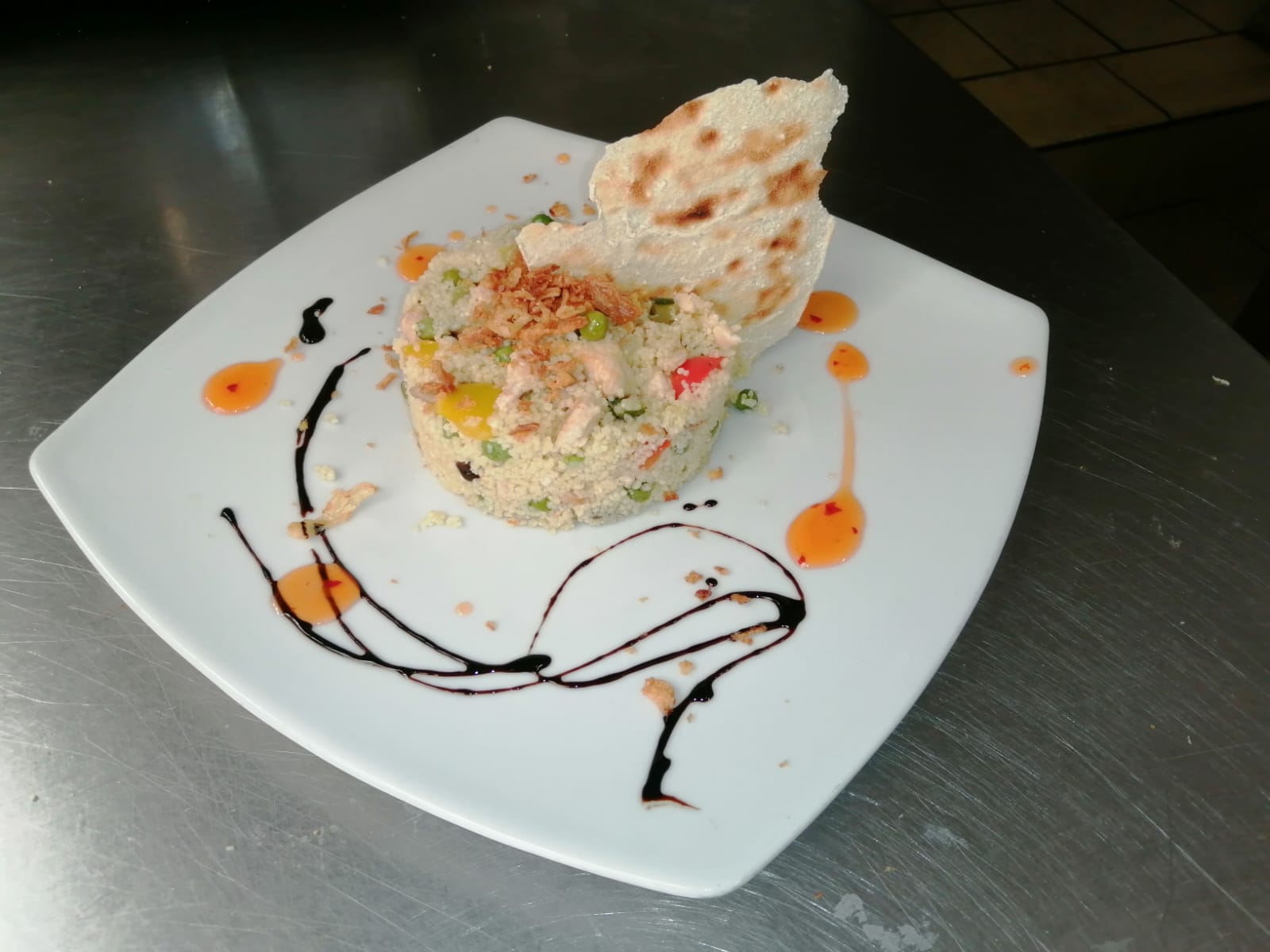 Couscous con verdure di stagione e papadam croccante al Pino Bar Fano
